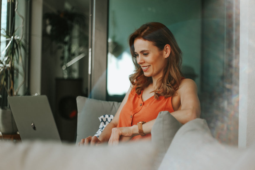 A woman flexible working on a laptop from home