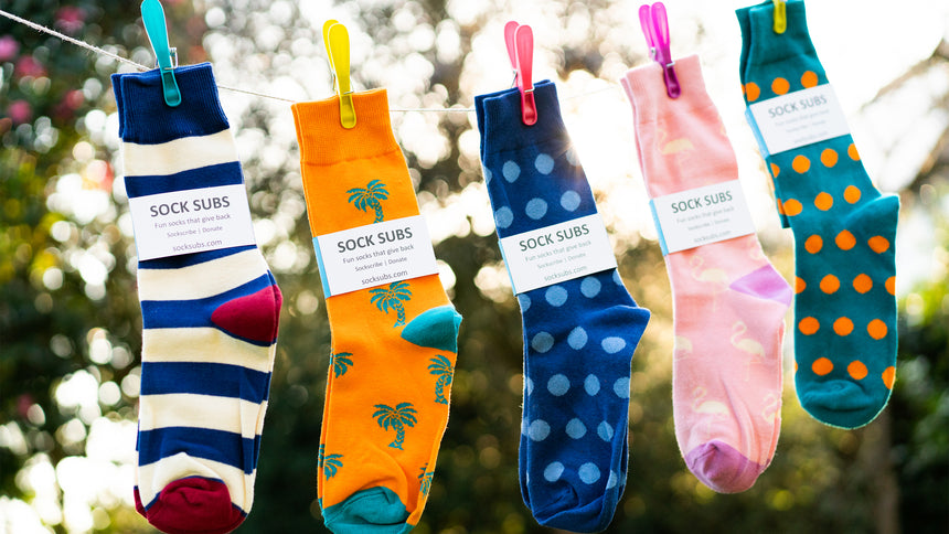 The Mór Card Sock Subs Brightly Coloured Socks on a Line